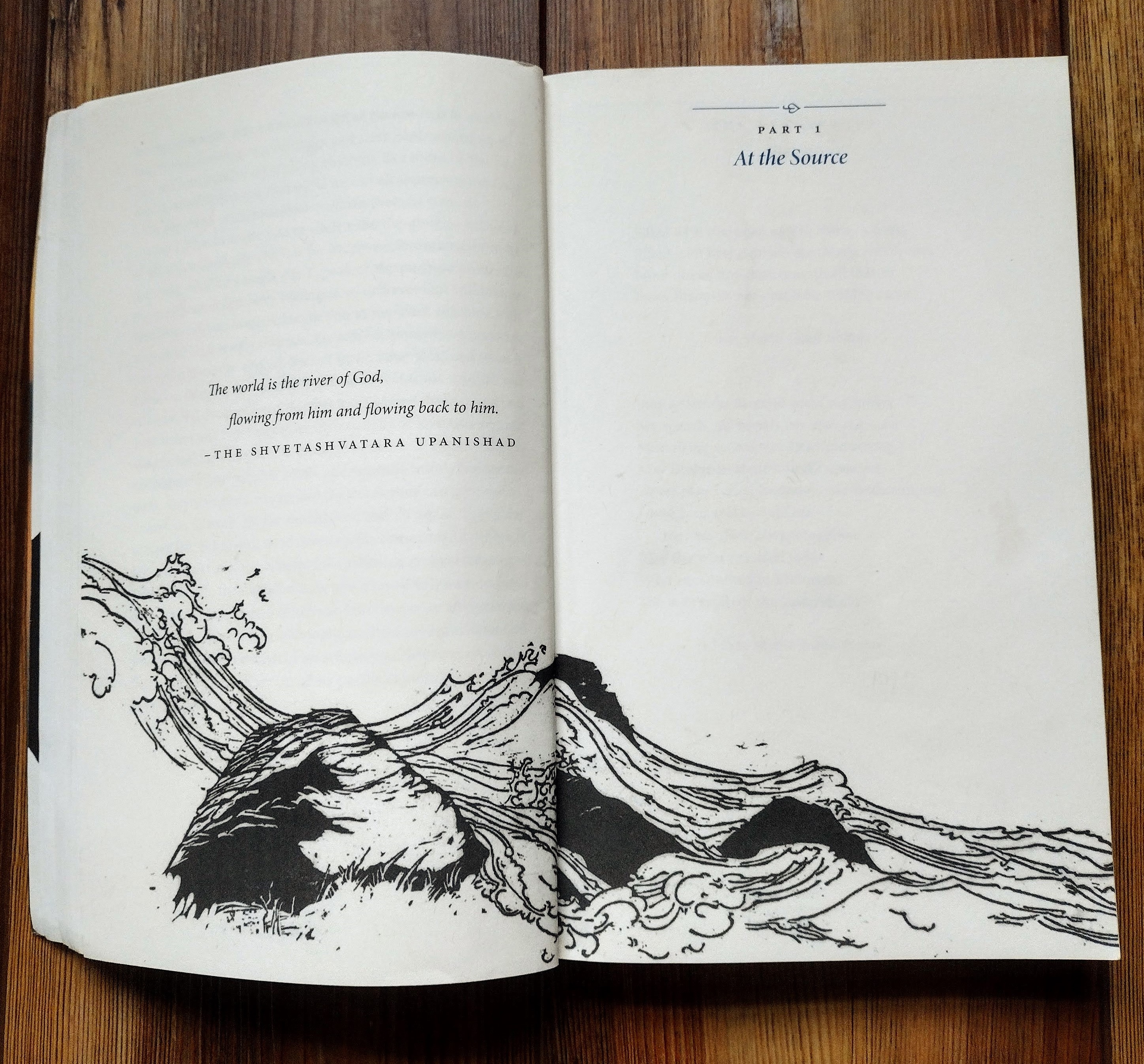 open pages of a book showing an ink woodcut illustration of waves  