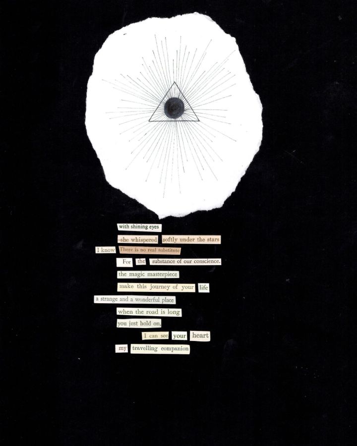 Black paper with pen drawing of triangle and circle with stickers printed with text